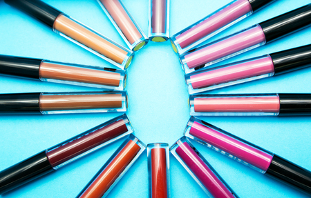 close up lipsticks matte color on blue background with space for text from top view. shade of Lipstick colour background.の写真素材