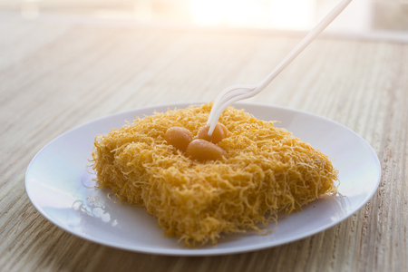 thai traditional cusine dessert from yolk ,sweet coconut milk and  brown shugar call Cake foi thong...