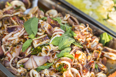 close up spicy squid fried with ginger and herb of Thai seafood.の写真素材