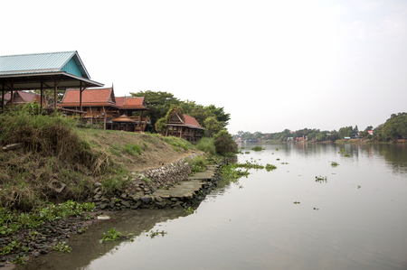 Thai home architecture old style on riverside.  architecture home from wood in unique style.の写真素材