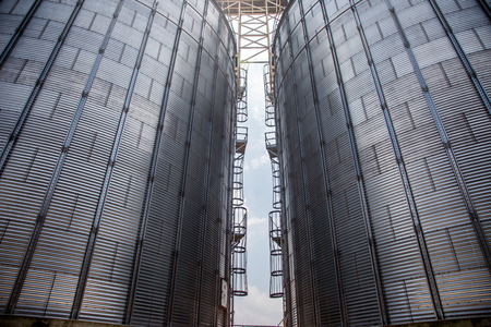 exterior of big silo technology in sun beam light in agriculture life.の写真素材