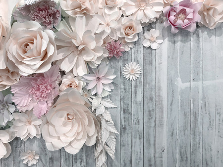 paper flower decoration on wood background. romantic decoration wedding ceremony concept with space for textの写真素材
