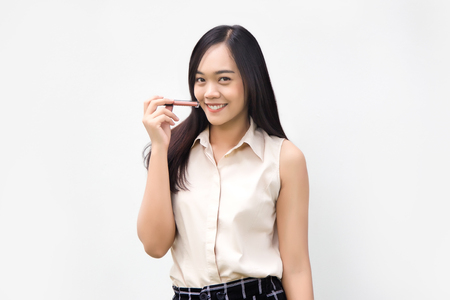 asian lady show lipstick with her lips on white backgroundの写真素材