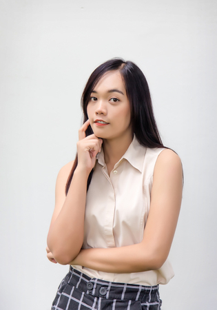 portrait asian lady smile post and look at camera on white backgroundの写真素材