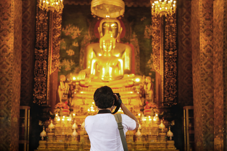 backyard of photographer capture gold buddha figure in Thailand temple. Beauty in religionの写真素材