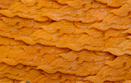 close up art of candle pattern like fire in candle ceremony in Thailandの写真素材