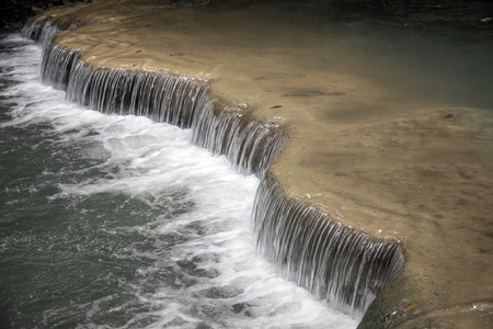 beautiful waterfall from mountain in raining season at Thailandの写真素材