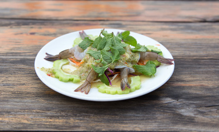 raw shrimp serve with seafood chilli sauce and mint leaf and herb. A famous thai food call "Koong Chare Nampla"の写真素材