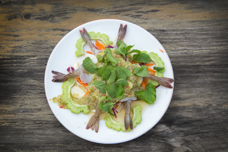 raw shrimp serve with seafood chilli sauce and mint leaf and herb. A famous thai food call "Koong Chare Nampla"の写真素材