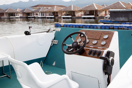 wheel controler and seat of yach boat on water resortの写真素材