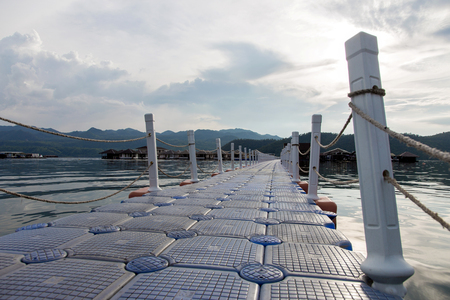 floating walk way on water to travel room for travelerの写真素材