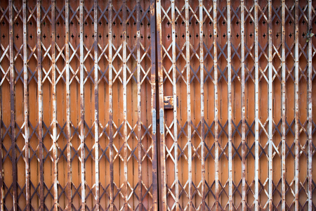 old iron door with iron handle. Old rusty gate handle on iron door.の写真素材