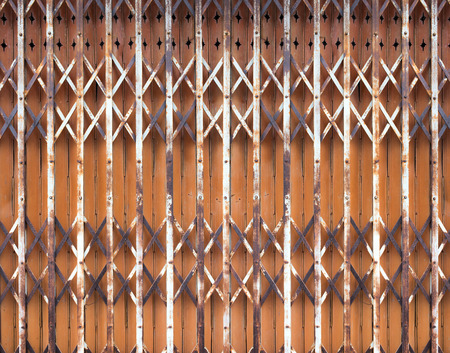 old iron door with iron handle. Old rusty gate handle on iron door.の写真素材