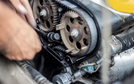 close up inside automobile engine gear fix in service