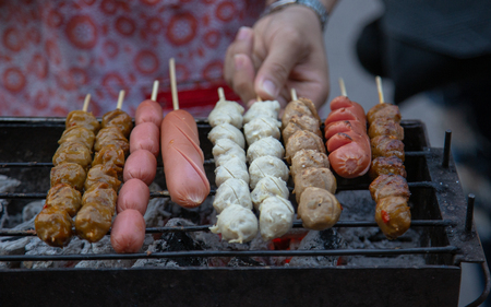 grill meat balls with stick the famous street food of Thailand.の写真素材