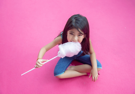 cute asian lady with business uniform suite with mini heart action on backgroundの写真素材