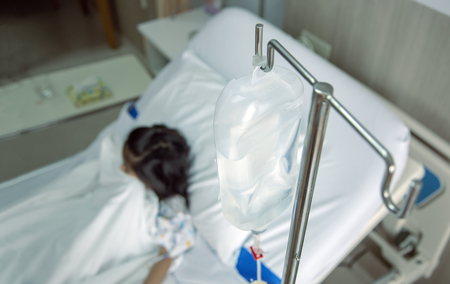 clinic heal kid Fluids Intravenous to blood vein in hosital room. Virus flue epidemic situation medicine healthy concept.の写真素材