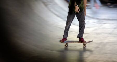 skateboard player on half pipe extreme sport indoor parkの写真素材