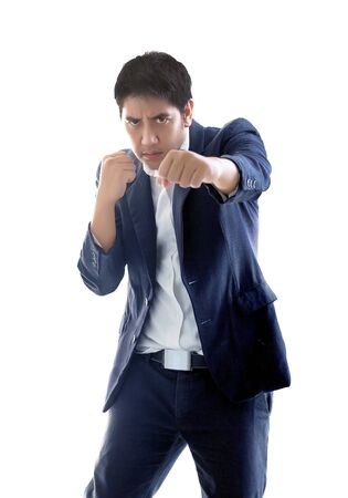 smart asian businessman puch action figthing concept on white isolated backgroundの写真素材
