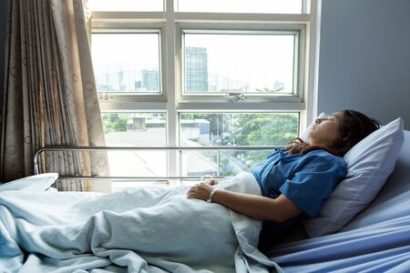 patient sleeping in hospital for seeking opportunity and better life,Patients is glad recovered from the illness.の写真素材