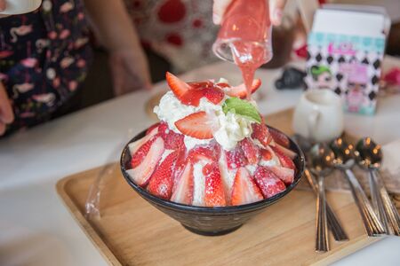strawbery dessert party made from icing milk with strawberry sauce serve for sweet day from top viewの写真素材