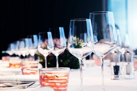 wine glass and kitchen ware on dinner table with friendshipの写真素材