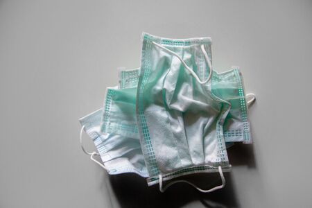used medical mask in virus situation on gray backgroundの写真素材