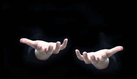 open human hand on dark background for present idea object on copy space with light up