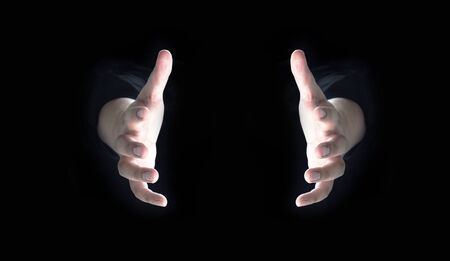 open human hand on dark background for present idea object on copy space with light up