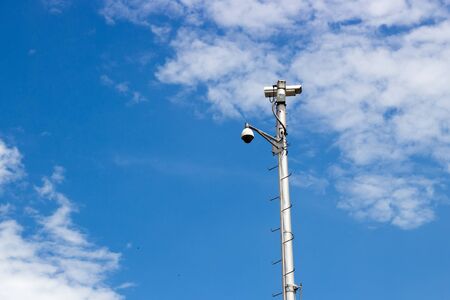 cctv on high iron post with clear sky on background for securityの写真素材