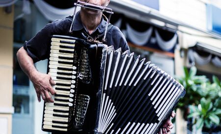 close up musician playing accordion show entertainment on street with vintage themeの写真素材