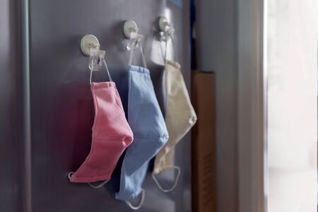 keep fabric mask for protect virus pandemic on refrigeratorの写真素材