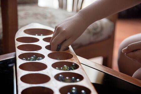 Close up kalaha game for practice math and strategic thinkingの写真素材