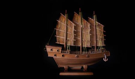 handmade barque boat from wood for decoration Chinise home on black backgroundの写真素材