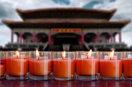 praying and meditation with burning candle on Chinese temple in new year festival of Chinese race.の写真素材