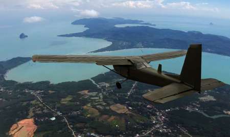 a vintage old plane flying on atmosphere to landing from skyの写真素材