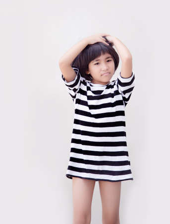 happy asian kid model with short hair on white isolated backgroundの写真素材