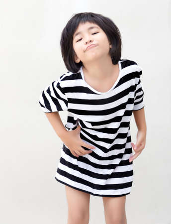 happy asian kid model with short hair on white isolated backgroundの写真素材