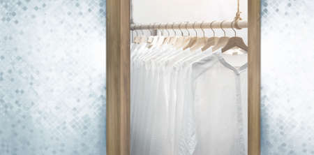 classic men white shirt on walk in clothes shelf for display uniform with wood hangerの写真素材