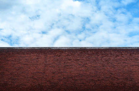 old asian temple roof tiles design and dark cloudy sky backgroundの写真素材