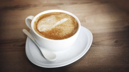 hot cappucinno serve on wood table in banner sizeの写真素材