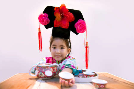 cute asian chinese kids with traditional costumeの写真素材