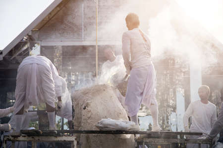 9 September 2017, Pattaya,Thailand.Gold pouring ceremony in buddhism relagion for making Buddha sculpture at templeのeditorial素材