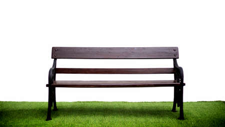 old wood outdoor seat on green grass with white isolated background (inblude path)の写真素材
