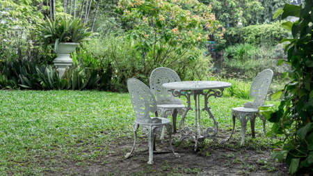 iron seat on english garden style in eveningの写真素材