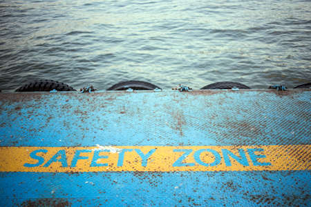 iron pier with safety zone Line on the watersideの写真素材
