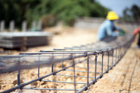 close up knot of iron net for making strong construction site from manpowerの写真素材