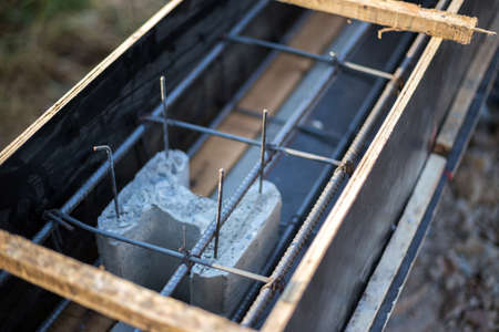 close up inside construction cement wall with wood and steel for strong
