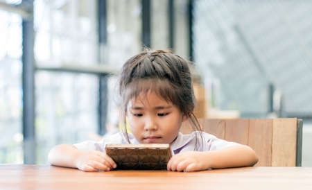 asian girl thinking out of box find creative idea with reflex revert angle of eye viewの写真素材