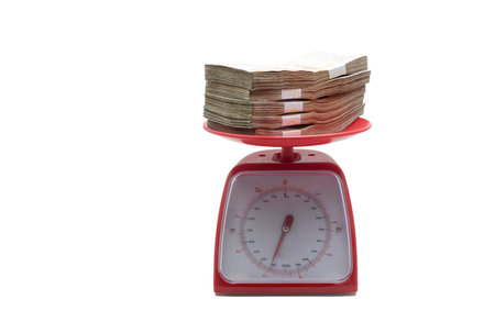 weight money bank on scale on white isolated background (include path)の写真素材